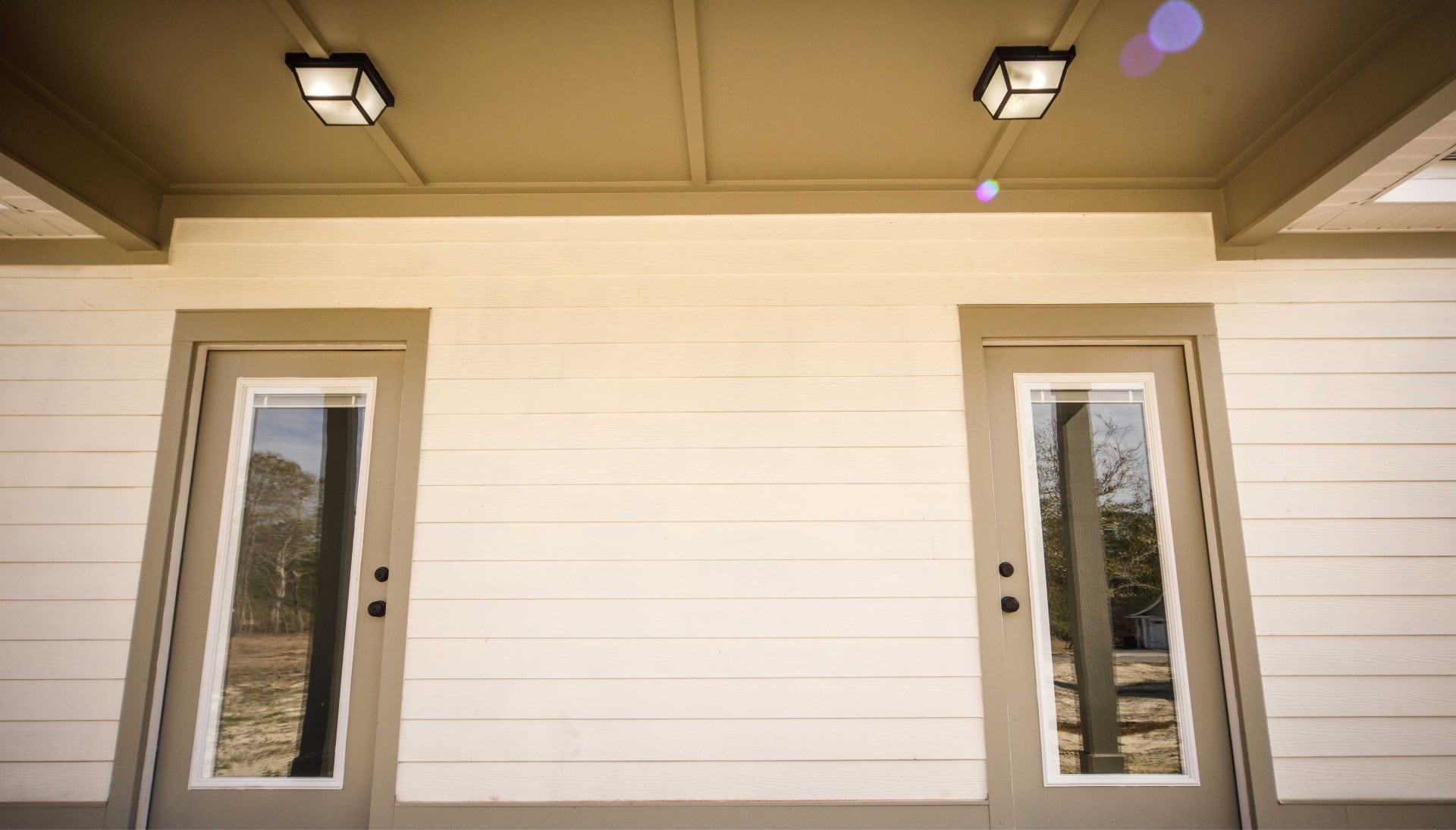We offer siding services in Topeka, Kansas. Hardie plank siding installation in a front entry way.